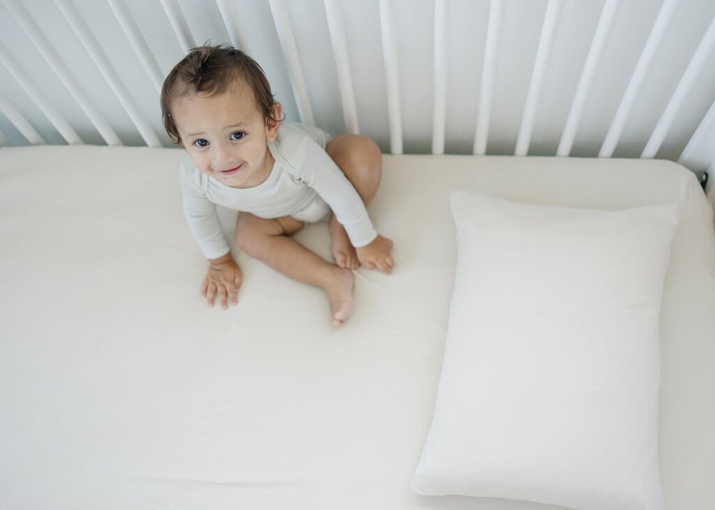 Organic cotton fitted crib sheet in an oat color